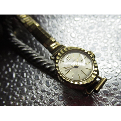 99 - Early C20th Swiss ladies rolled gold wristwatch on expanding bracelet, three Timex ladies watches an... 