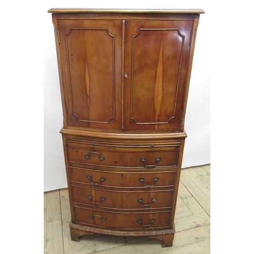 640 - Small Geo.III style bowfront yew cocktail cabinet, with two panelled doors and brushing slide above ... 