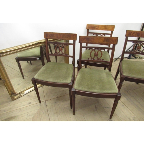 646 - Set of four Regency style mahogany dining chairs with pierced splat and drop in seats on fluted supp... 