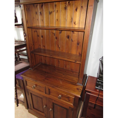 649 - Stained and waxed pine modern dresser, twin shelf back, enclosed by reeded columns, the base with tw... 