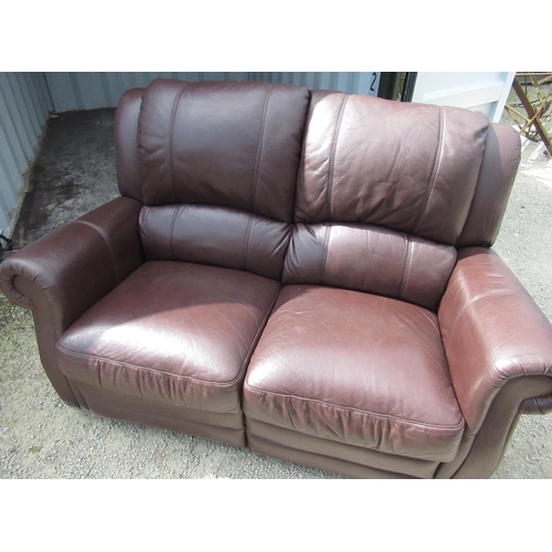 650 - Brown leather three piece suite comprising: three reclining seat and two reclining seat sofas and an... 