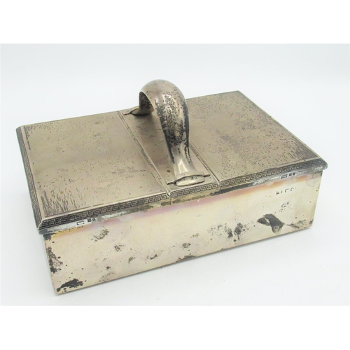 1151 - Geo.V Art Deco hallmarked Sterling silver Treasury style cigar box, with strap work handle, engine t... 