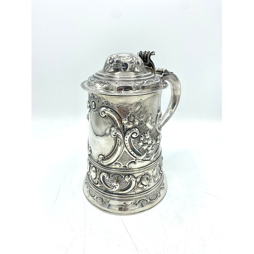 1155 - Geo.III hallmarked sterling silver lidded tankard, probably later engraved and repousse with flowers... 