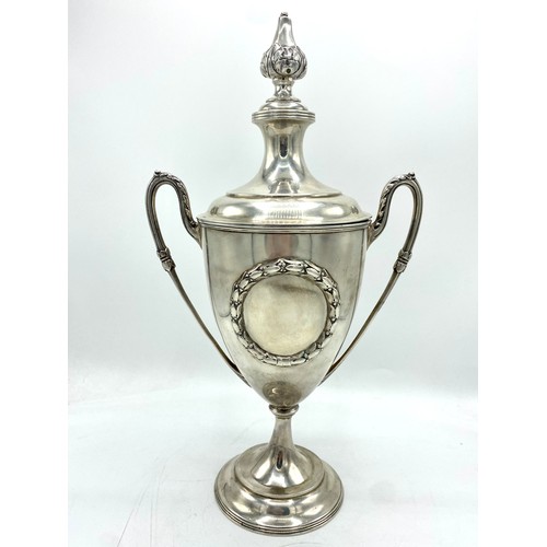 1154 - Geo.V hallmarked sterling silver urn shaped  presentation cup with tapering cover with leaf finial, ... 