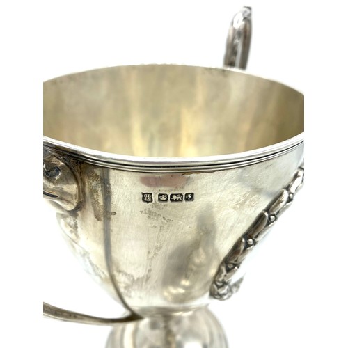 1154 - Geo.V hallmarked sterling silver urn shaped  presentation cup with tapering cover with leaf finial, ... 