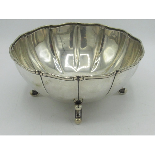 1171 - Early C20th Continental silver shaped circular bowl, with repousse rim on four four C scroll feet, s... 