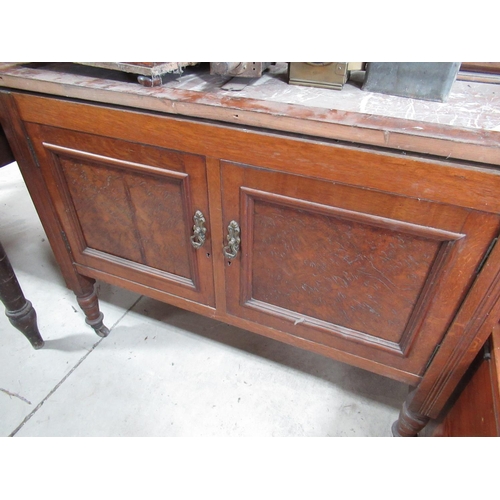 612 - Edwardian oak wash stand, with rouge marble splash back above two doors on turned supports (no top) ... 