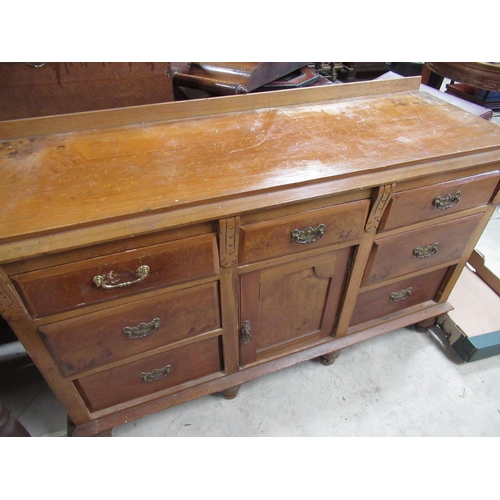 622 - Victoria scumbled pine dresser with three drawers above central paneled door enclosed by four drawer... 