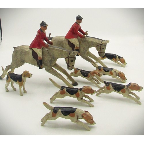 1235 - C1920s-1930s hand carved wooden hunt group including two horses, two riders and seven dogs (possibly... 