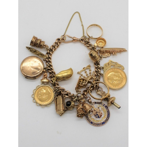 1111 - Hallmarked 9ct yellow gold charm bracelet Chester, 1902, with a collection of charms including Geo.V... 