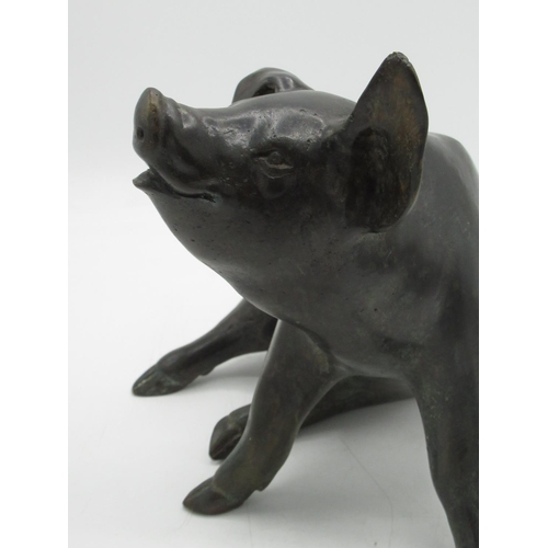 1219 - Patinated cast bronze model of a seated pig, L26cm H20cm