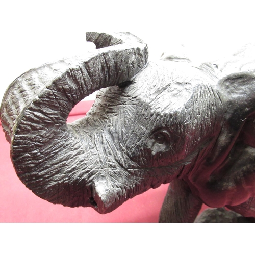 1220 - Large carved stone model of an elephant, standing with curled trunk, L50cm H30cm