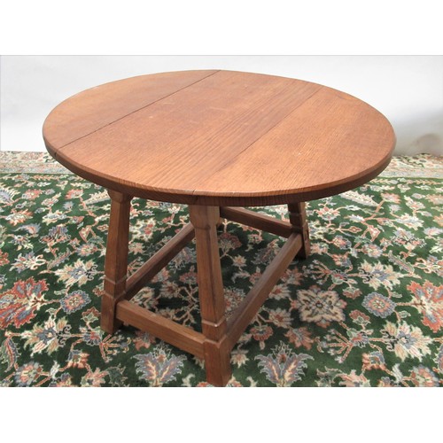 1430 - Alan Acornman Grainger of Brandsby - an oak oval drop leaf coffee table on out splayed square suppor... 