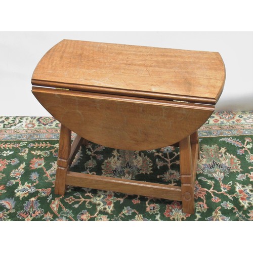 1430 - Alan Acornman Grainger of Brandsby - an oak oval drop leaf coffee table on out splayed square suppor... 