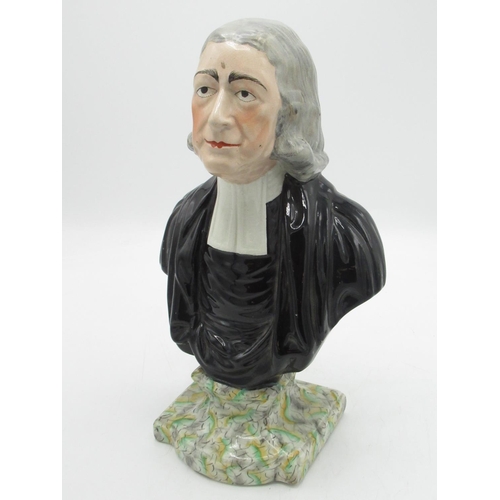 1257 - C19th head and shoulder bust of Rev. John Wesley in clerical robes, on a shaped marbled plinth, with... 
