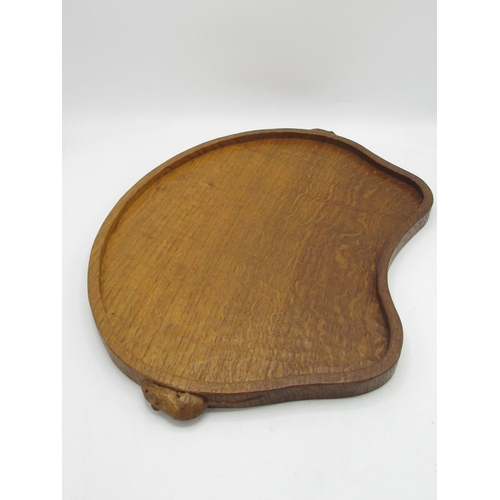 1418 - Robert Mouseman Thompson of Kilburn - an adzed oak kidney shaped galleried tray, carved with two sig... 