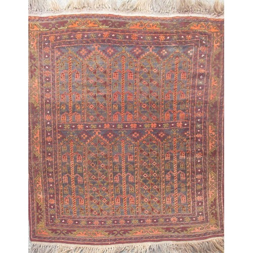 1393 - Caucasian wool red ground rug, with central pattern field, surrounded by floral pattern border, 95cm... 
