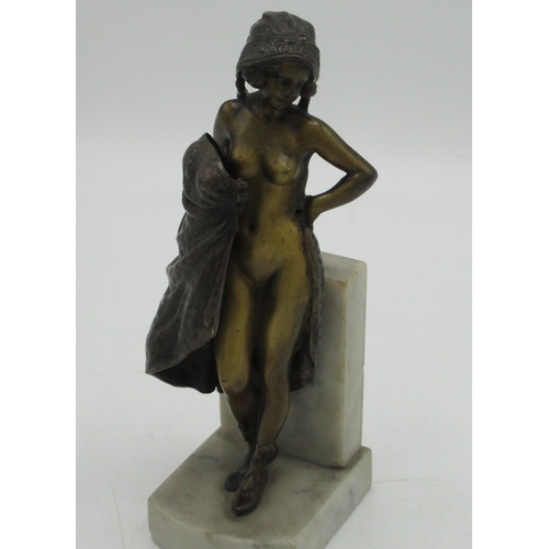 1225 - After Franz Bergman: an erotic bronzed model of a young girl, her dress opening revealing her naked ... 