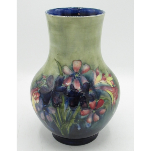 1256 - Moorcroft pottery vase, baluster body decorated with Orchids and Spring flowers, impressed marks in ... 