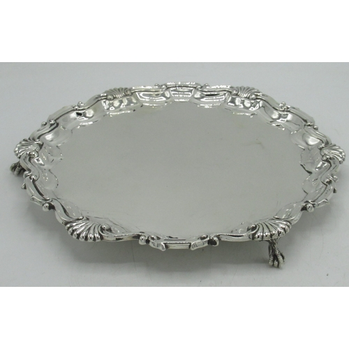 1156 - Geo.III style Victorian hallmarked sterling silver circular salver, shell and scroll cast border on ... 