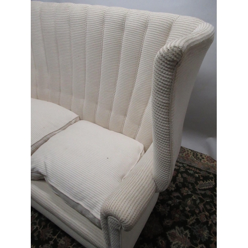 1460 - Edwardian upholstered sofa with pleated high wing back, outscrolled arms and two loose seat cushions... 