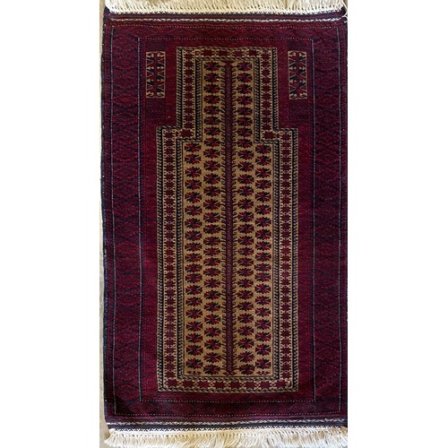 1391 - Afghan red ground wool rug with central beige ground field set with multiple geometric floral motifs... 