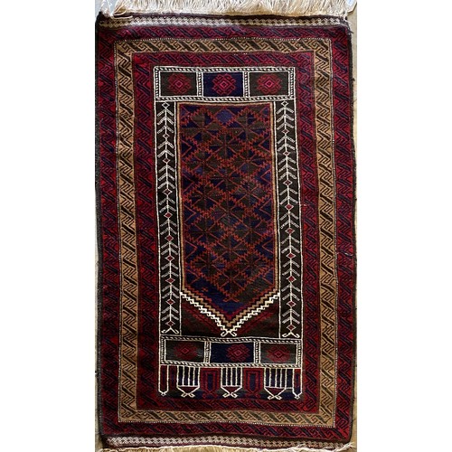 1392 - Kayam red and antque gold ground wool rug with central field and stylised alternating geometric patt... 