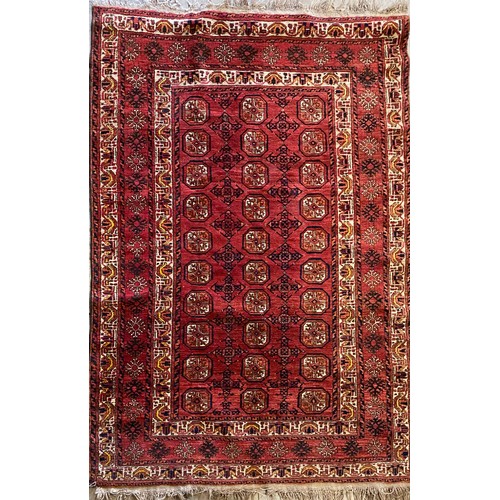 1387 - Kazak style woven red ground rug central field set with octagonal medallions beige ground border set... 