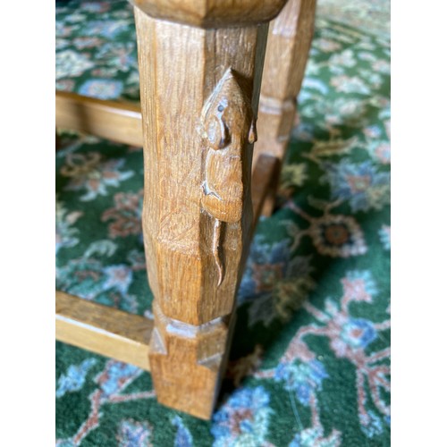 1417 - Robert Mouseman Thompson of Kilburn - an oak rectangular stool, plaited leather top on octagonal bal... 