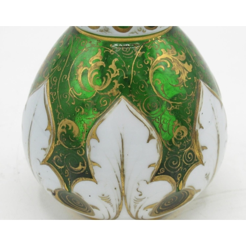 1267 - C20th white overlaid green glass oil bottle, mallet shaped body with gilt scrollwork, faced clear gl... 