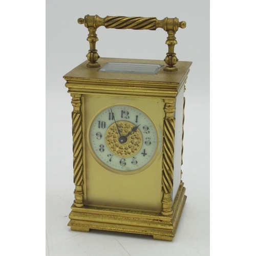 1404 - C20th gilt brass cased carriage timepiece, circular cream Arabic dial with blued steel hands, wrythe... 