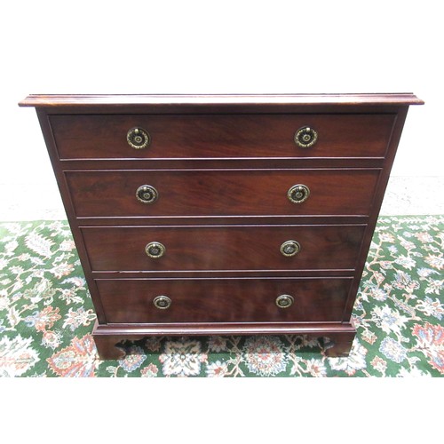 1445 - Small C19th mahogany chest, moulded top and four cockbeaded drawers with brass ring handles on shape... 