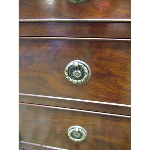 1445 - Small C19th mahogany chest, moulded top and four cockbeaded drawers with brass ring handles on shape... 