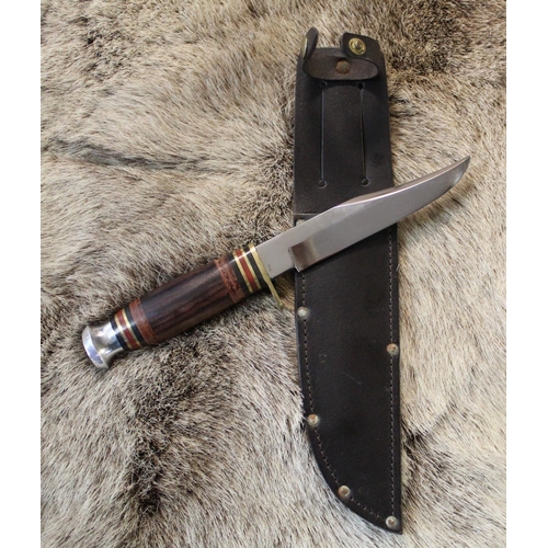 173 - J Nowill bowie knife with clip blade and wooden and leather handle, brass cross guard and steel pomm... 