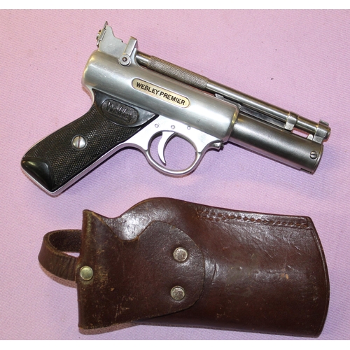 175 - A Webley Premier .22 over lever action air pistol, in working order with leatherr holster. 763 stamp... 