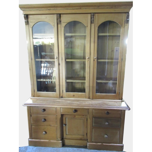 1447 - Large Victorian and later pine bookcase, moulded cornice above four glazed doors with three adjustab... 