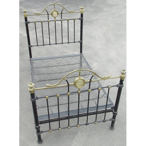 1473 - Victorian cast iron bedstead, arched head and foot with brass cresting, urn finials and mirrored bos... 