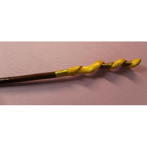 134 - A cherry shank walking staff with honeysuckle twist carved into a snake with gold coloured metal col... 