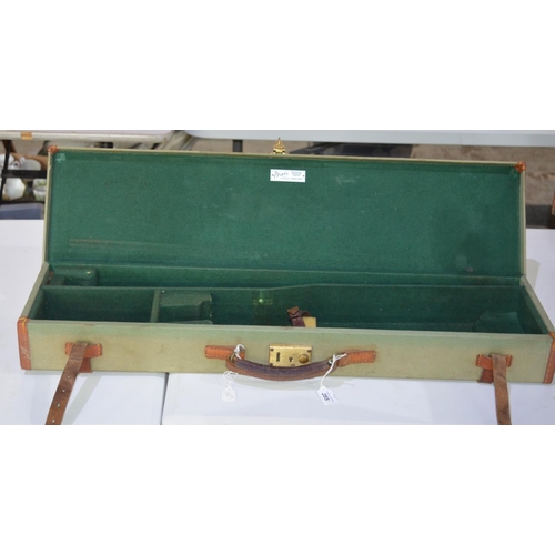 285 - Brady rectangular light green canvas gun case with green felt interior and leather fastening (A/F)