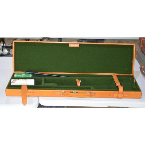 290 - Gunmark rectangular light brown leather gun case with green felt interior and leather fastening