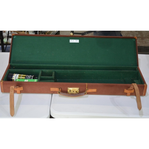 291 - Brady rectangular brown canvas gun case with green felt interior and leather fastening