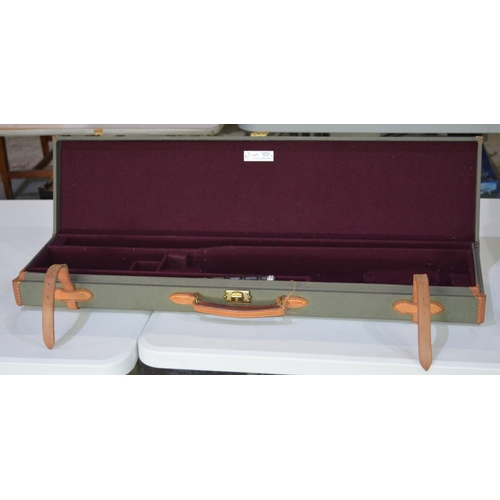 292 - Brady rectangular light green canvas gun case with purple felt interior and leather fastening