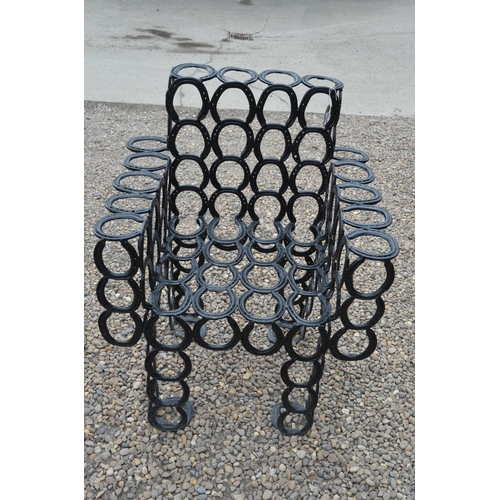 1483 - Hand crafted garden seat constructed from used horse shoes, H99cm W79cm L50