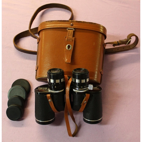 76a - A pair of Japanese Tohyoh action tested 7x-15x35 binoculars with leather case.