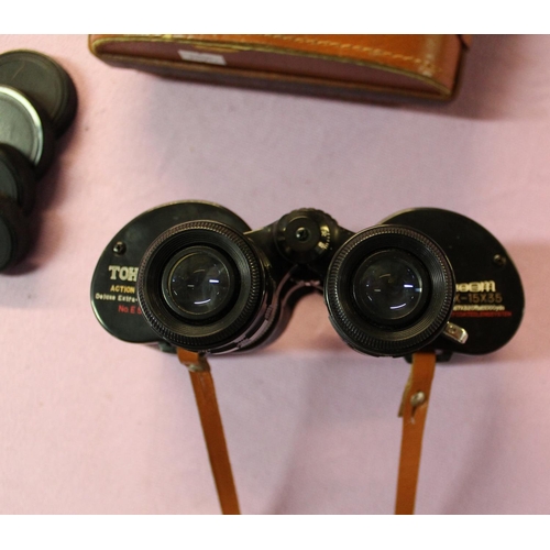 76a - A pair of Japanese Tohyoh action tested 7x-15x35 binoculars with leather case.