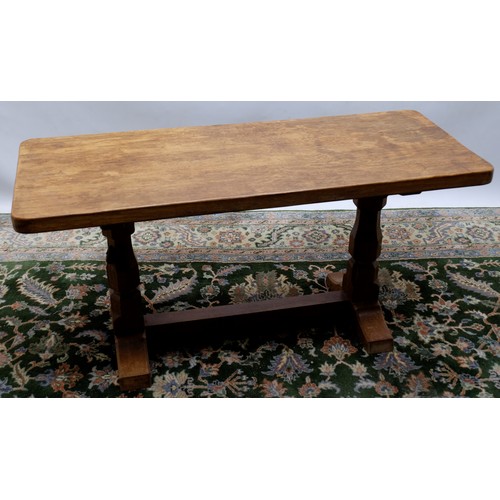 1422 - Robert Mouseman Thompson of Kilburn - an oak rectangular coffee table, adzed top on octagonal balust... 
