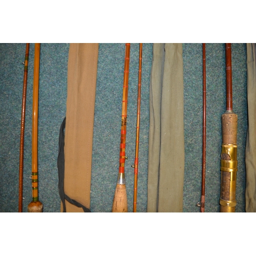 112 - Three vintage fishing rods:
An early carbon fibre two piece fishing rod L214cm, also 