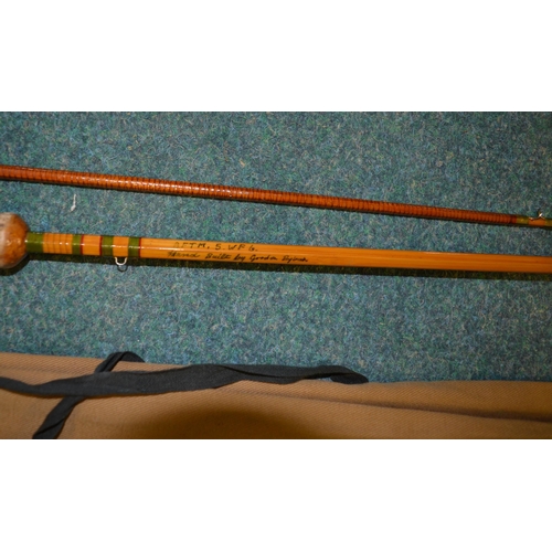 112 - Three vintage fishing rods:
An early carbon fibre two piece fishing rod L214cm, also 