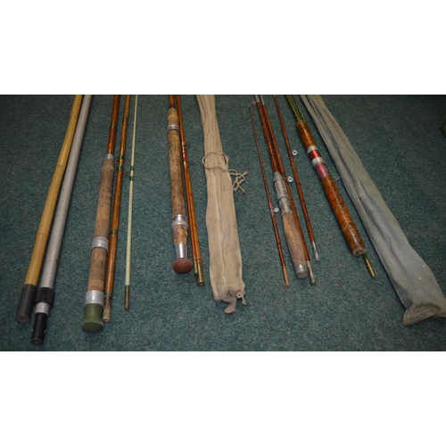 Two landing net handles and four vintage fishing rods: A Milbro early  fibreglass two piece general p