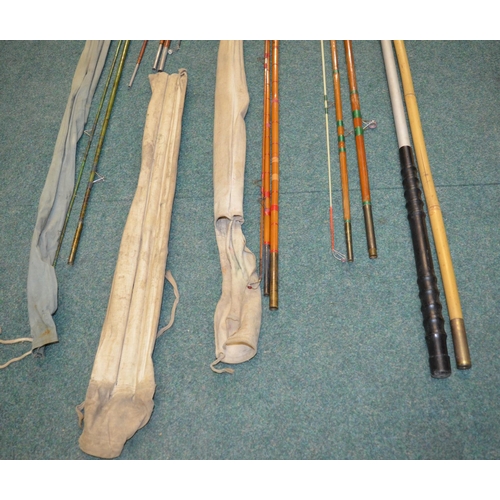 106 - Two landing net handles and four vintage fishing rods:
A Milbro early fibreglass two piece general p... 